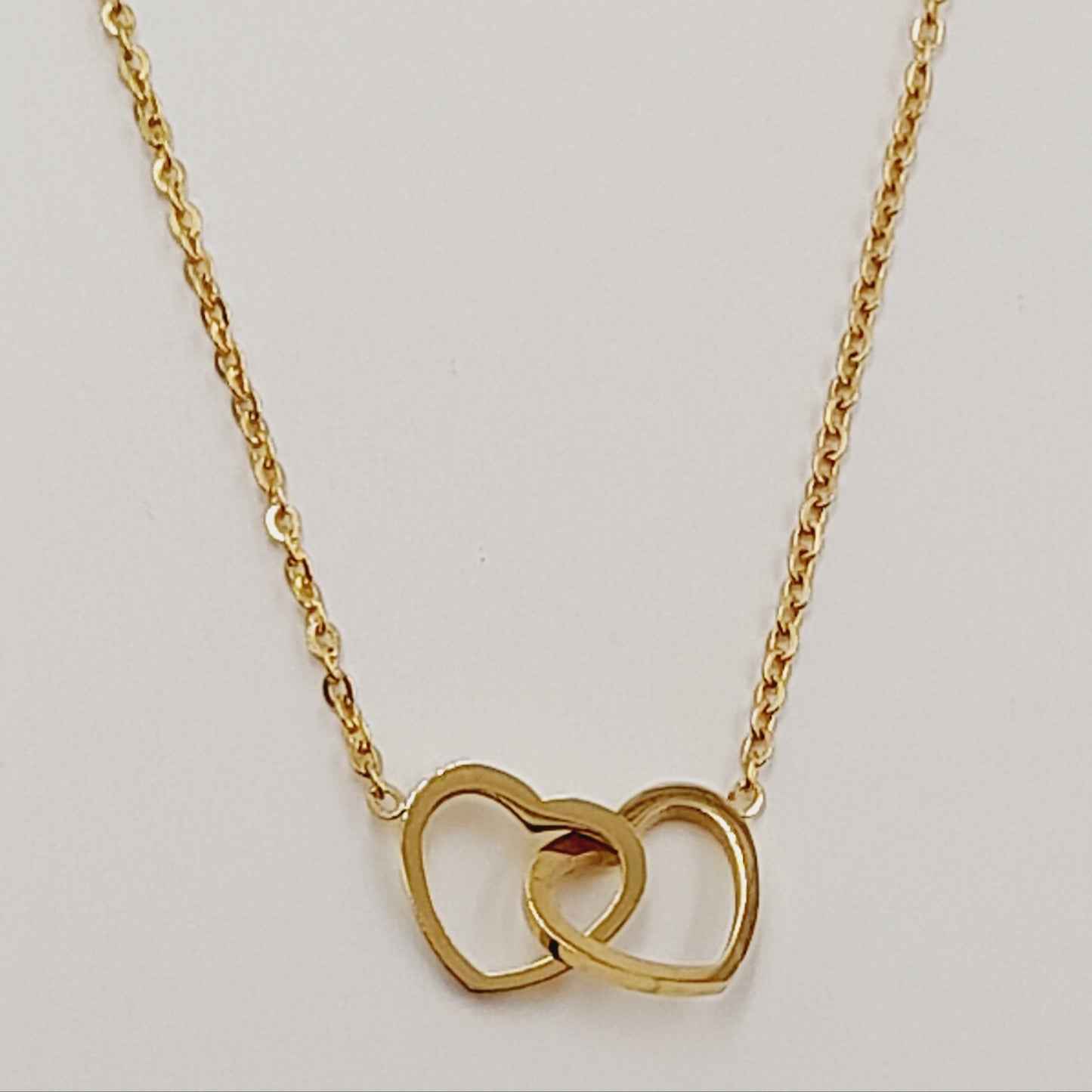 Conjunto 2 corazones acero dorado