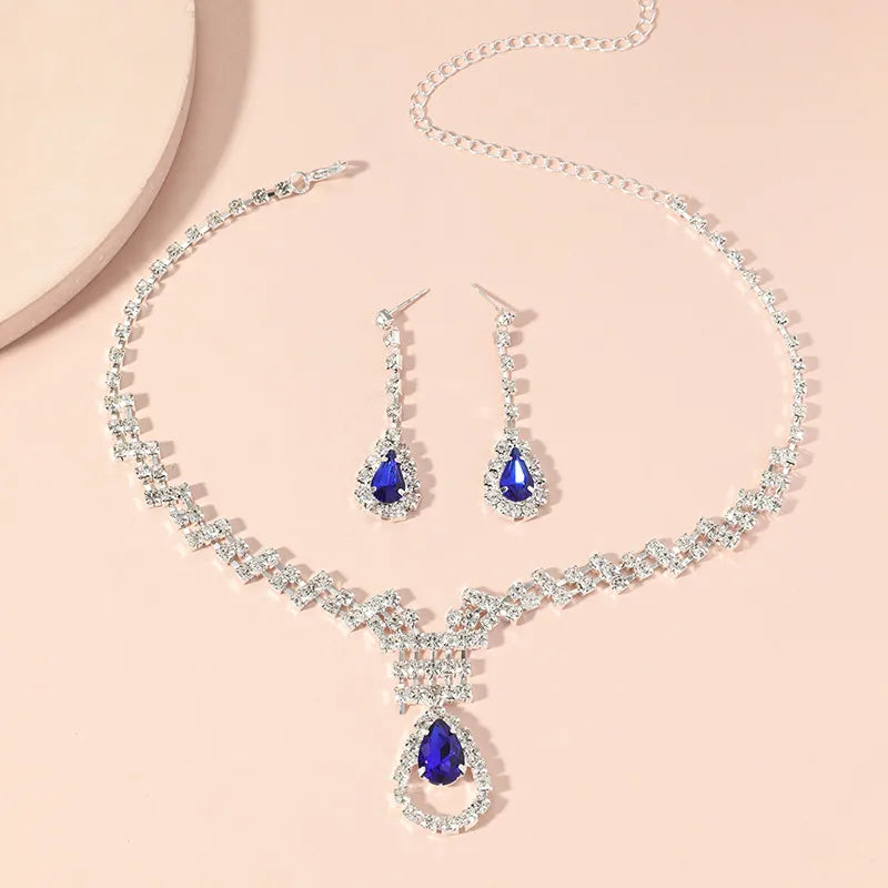 Conjunto de bijouterie plateado con strass y piedra azul
