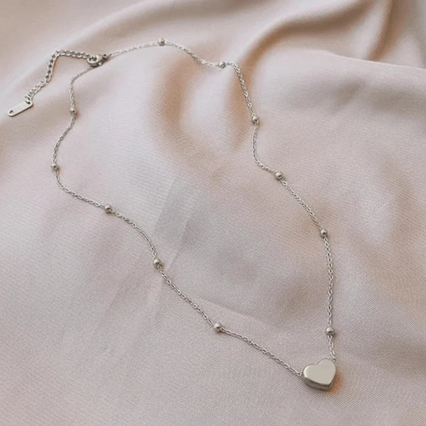 Collar corazón inflado con bolitas en acero