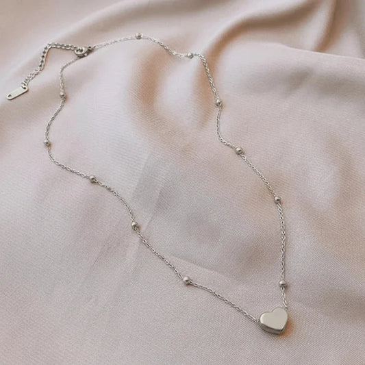 Collar corazón inflado con bolitas en acero