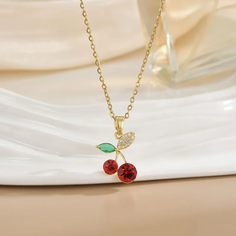 Cadena y dije Cerezas con Brillo en acero dorado