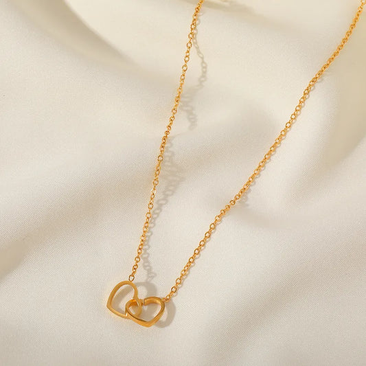 conjunto corazón doble en acero dorado