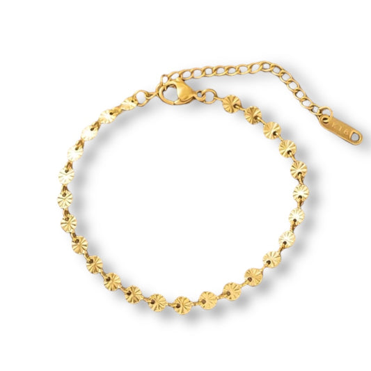 Pulsera de acero dorado con discos facetados