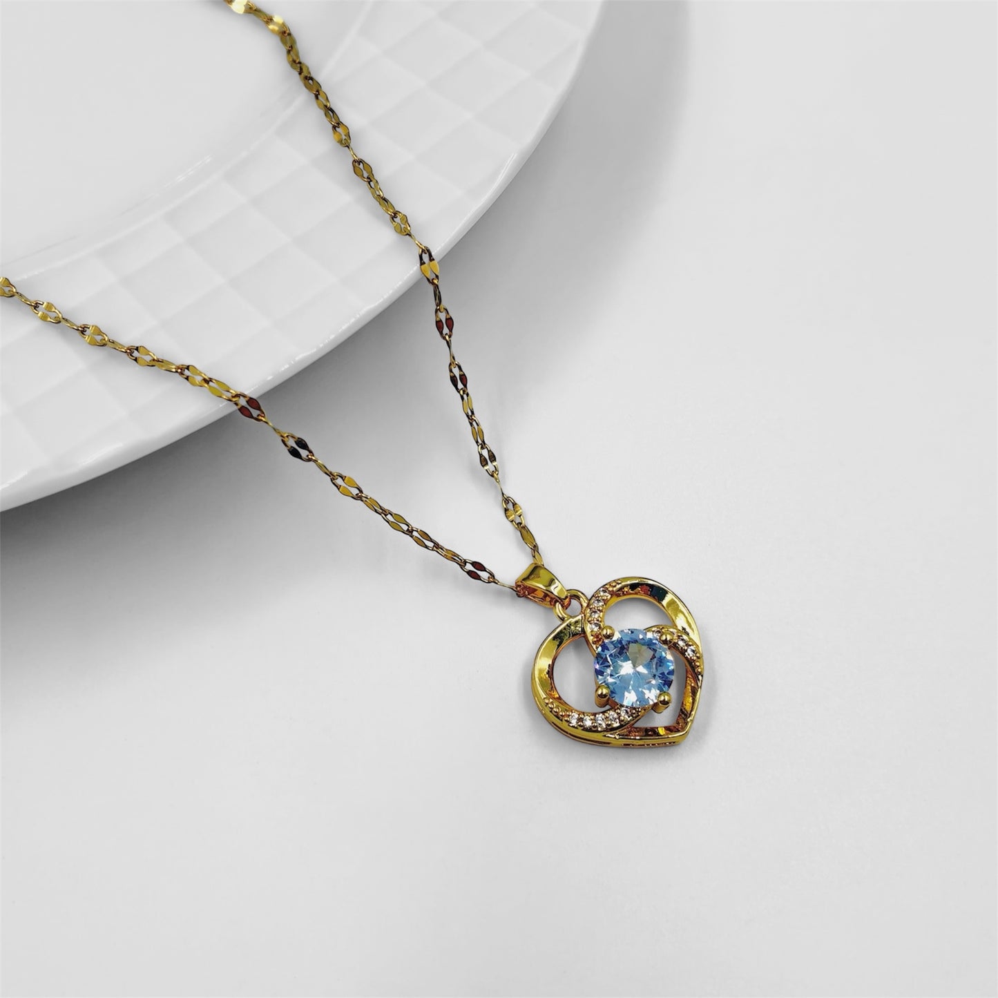 Cadena y dije acero dorado corazon con centro cubic