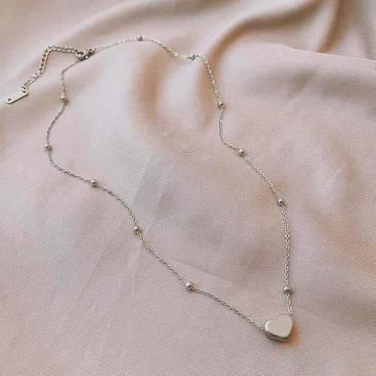 Collar corazón inflado con bolitas en acero