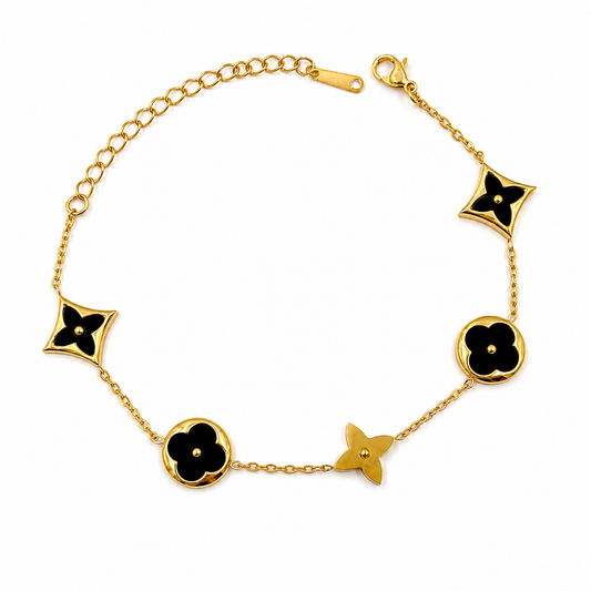 Pulsera con tréboles negro en Acero Dorado
