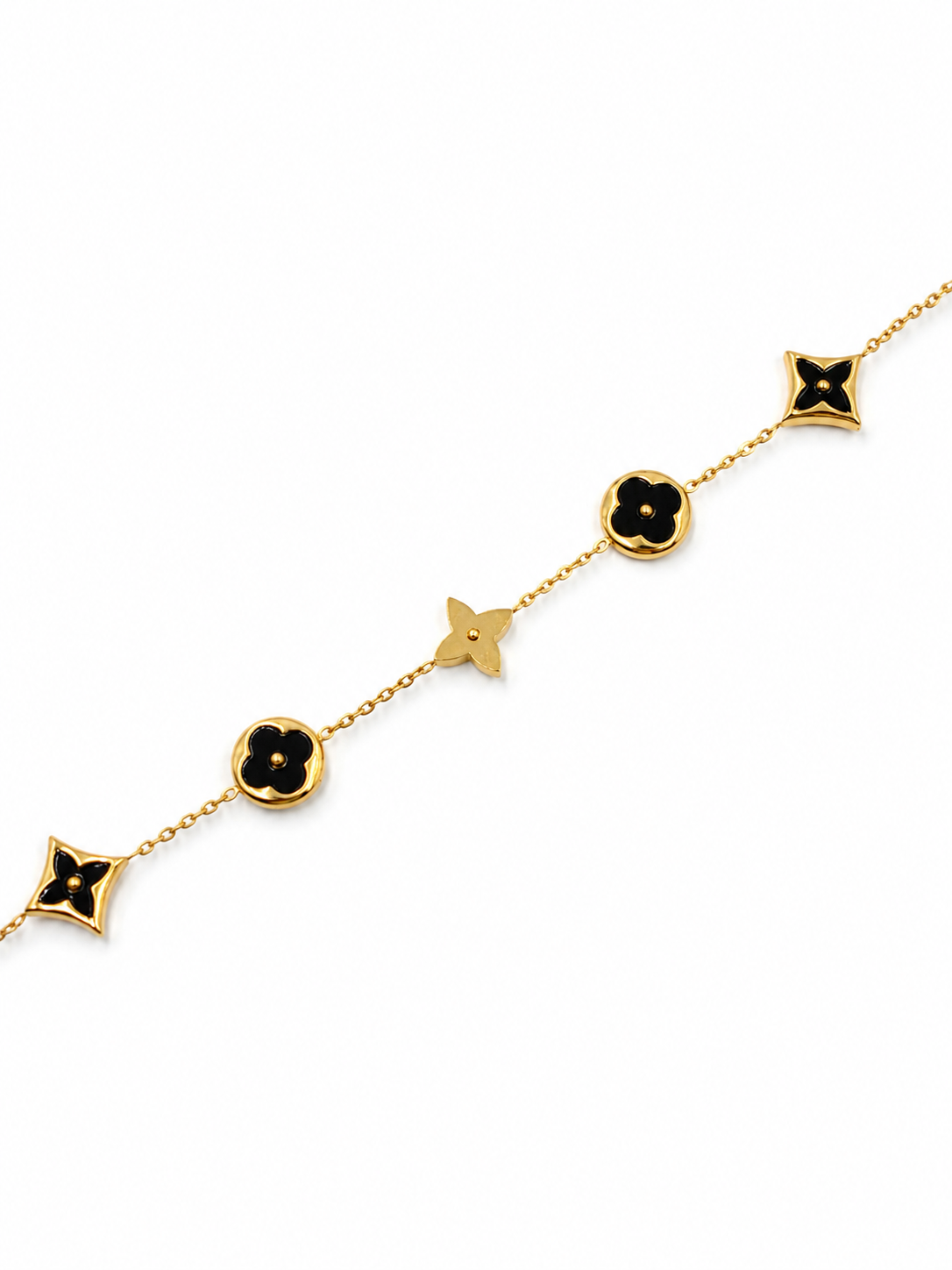 Pulsera con tréboles negro en Acero Dorado
