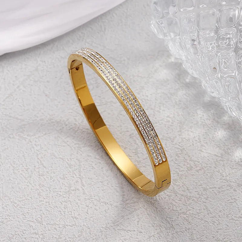Pulsera rigida de acero dorado con strass